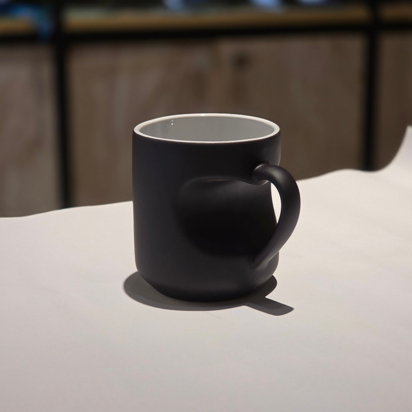 Black Heart Handle Magic Mug – Stylish Ceramic Coffee Mug