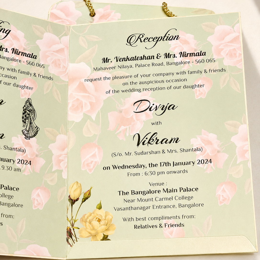 A three-panel wedding invitation card set with a pale green floral background, featuring elegant black script text for a reception and davos, adorned with pink roses and yellow flowers, hanging from gold rings.